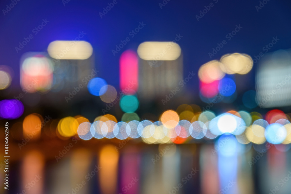 Fototapeta premium Night view of Nancheng business district in Dongguan, China. Blurred city light background.