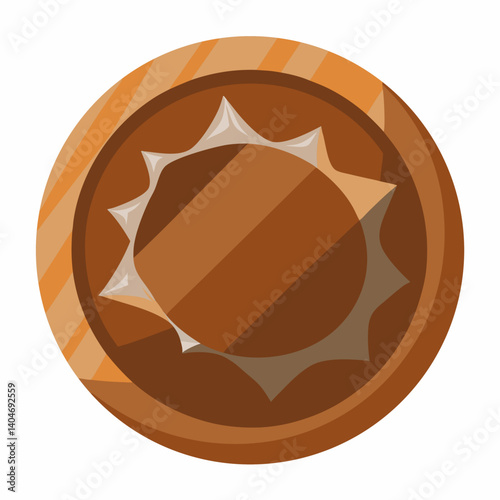 A chocolate ball wrapped in a shiny white wrapper, resting on a smooth surface.