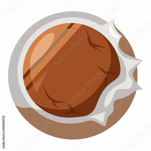 A chocolate ball wrapped in a shiny white wrapper, resting on a smooth surface.