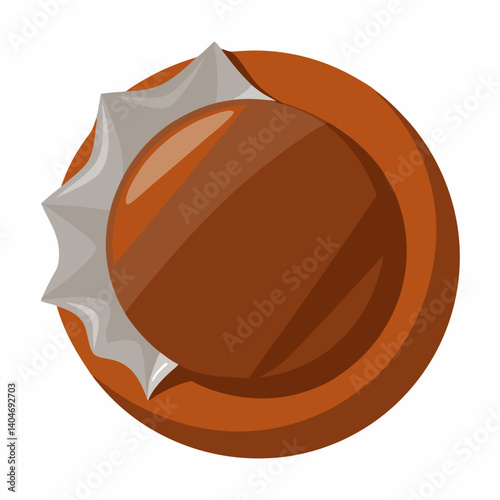 A chocolate ball wrapped in a shiny white wrapper, resting on a smooth surface.