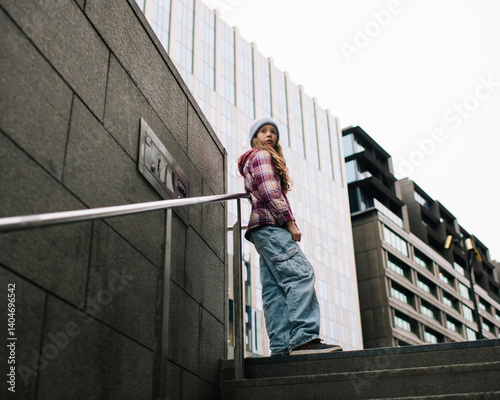 girl stood exploring near office buildings in the city of Stockholm