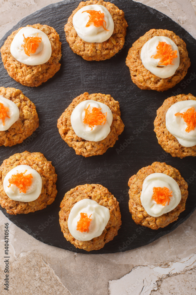 Cream Cheese Carrot Cake Cookies close up on the plate on the table. Vertical top view from above