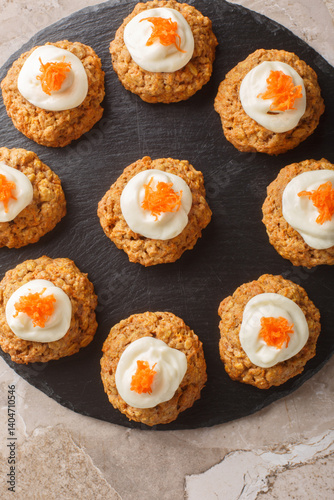 Obraz na płótnie Cream Cheese Carrot Cake Cookies close up on the plate on the table. Vertical top view from above w salonie
