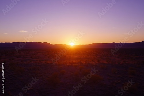 Dramatic Desert Sunset with Fiery Orange and Pink Skies photo