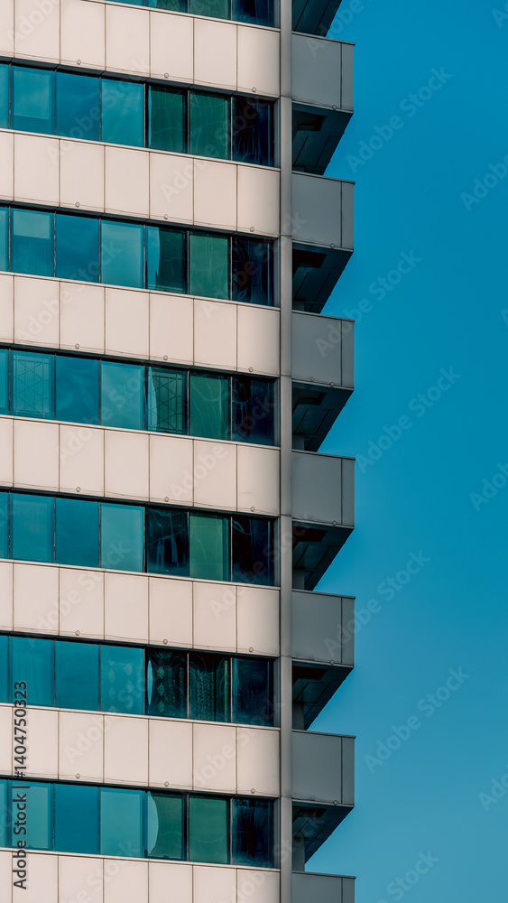 many windows and walls facade of a modern skyscraper without people many windows and walls facade of a modern skyscraper without people