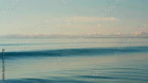 Wallpaper Mural Calm expansive ocean surface with small waves, under a pale sky, a serene nature seascape for backgrounds and travel themes Torontodigital.ca