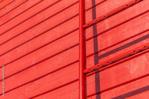 Red wall with a ladder