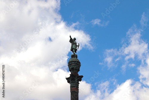 Christopher Columbus Monument Against a Cloudy Blue Sky in Barcelona, Spain