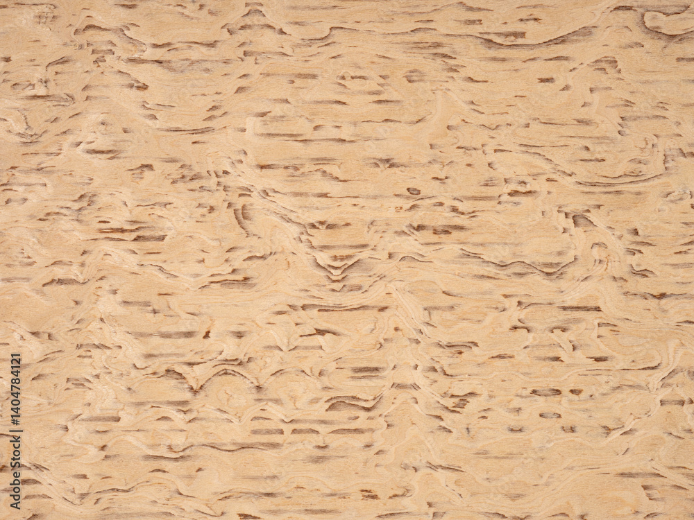 Rustic burl wood veneer surface showcasing a symphony of tan and beige whirls