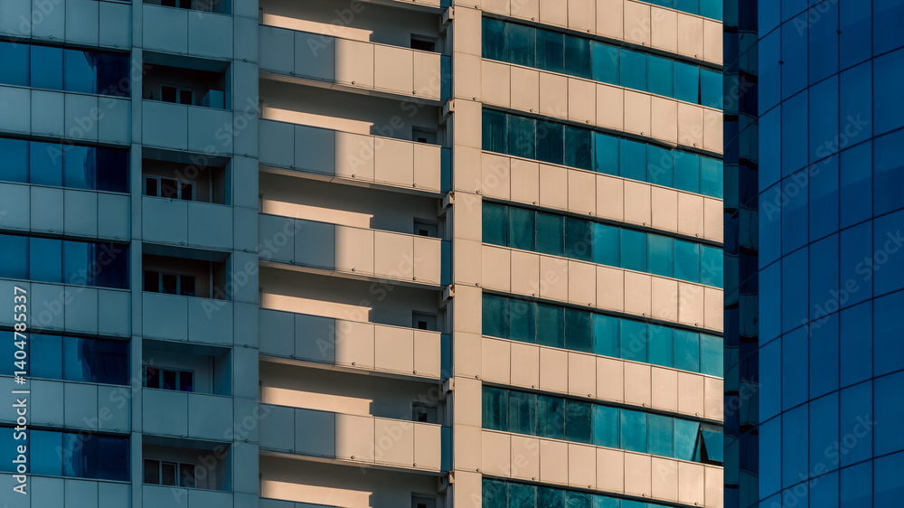 many windows and walls facade of a modern skyscraper without people many windows and walls facade of a modern skyscraper without people