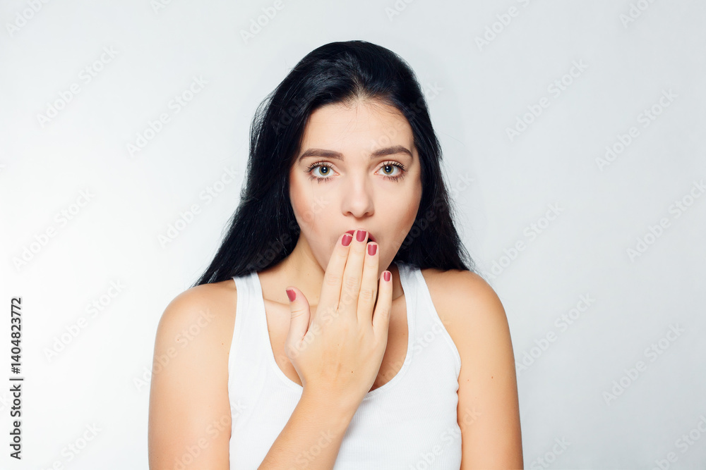 Portrait of young woman with shocked facial expression Portrait of young woman with shocked facial expression