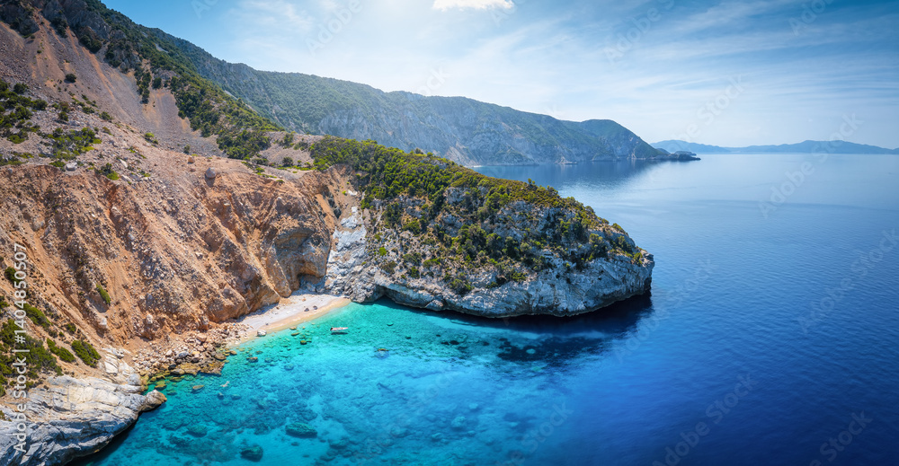 The remote west coast of Alonissos island, Sporades, Greece, with steep cliffs and emerald sea