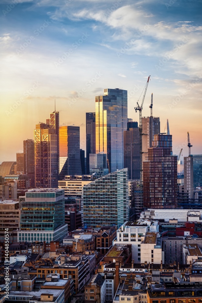 Elevated view of the skyline at the City of London, England, during a golden sunrise from a unique viewpoint