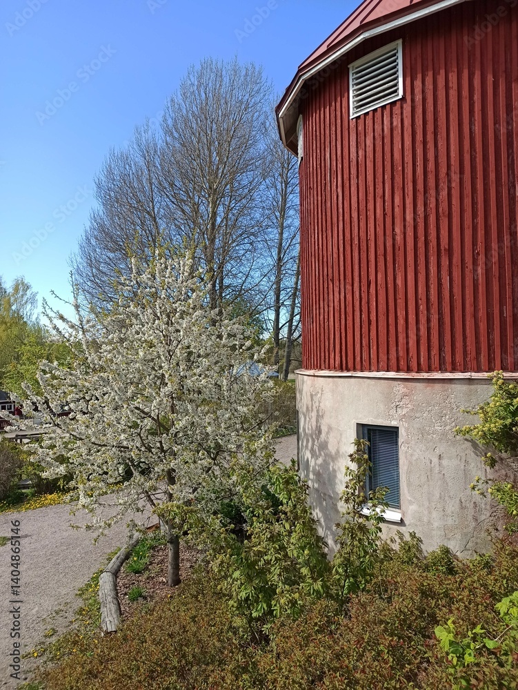 Aerial view of the roof of an old barn with blue sky