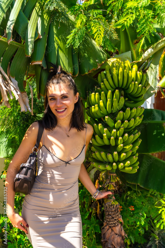 Tourist enjoying banana tree in ojos de garza, gran canaria