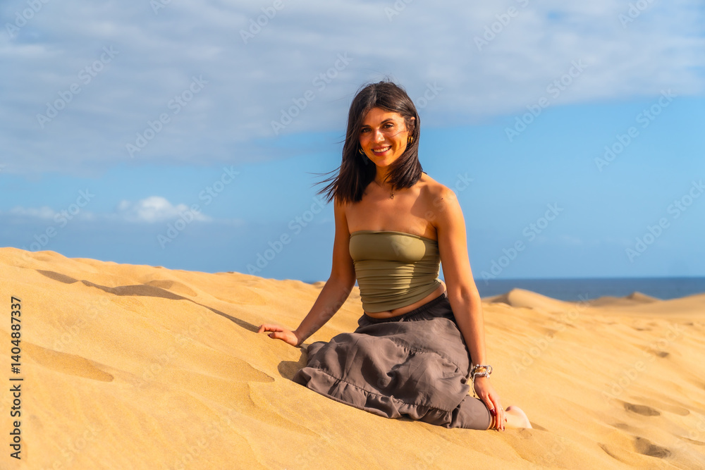 Tourist enjoying relaxing sunny day at maspalomas dunes in gran canaria