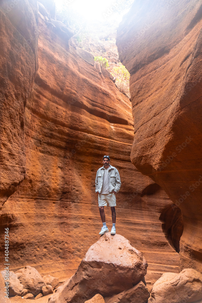 Tourist exploring the majestic barranco de las vacas in gran canaria