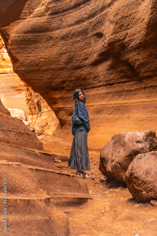 Tourist exploring the majestic barranco de las vacas in gran canaria