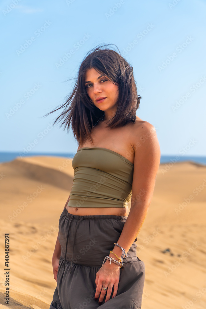 Young woman exploring the maspalomas dunes in gran canaria