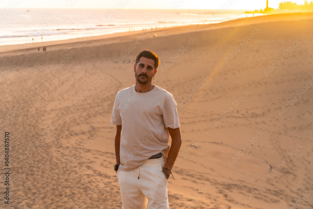 Tourist exploring maspalomas dunes at sunset in gran canaria