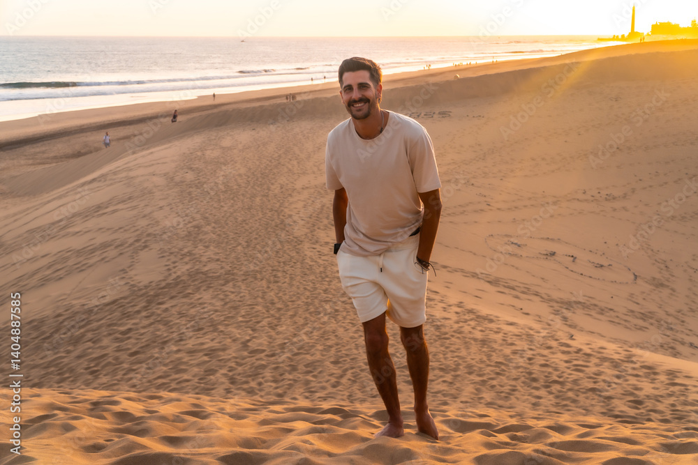 Tourist enjoying sunset over maspalomas dunes in gran canaria, spain