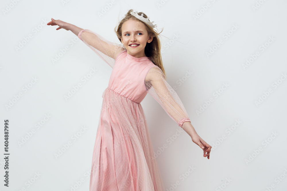 Joyful girl in a pink tulle dress, dancing against a light background, showcasing happiness and innocence, perfect for children s fashion concepts Joyful girl in a pink tulle dress, dancing against a light background, showcasing happiness and innocence, perfect for children s fashion concepts
