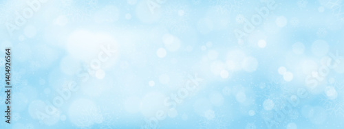 Winter background with soft blue gradient with snow flakes and blurry bokeh light effect,Concept for wallpaper of holiday seasonal for Christmas,New Year 2026 banner