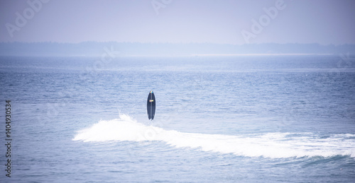 surfboard in the sea as a backdrop for a seaside holiday