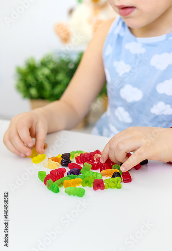 Child with jelly candies. Selective focus.