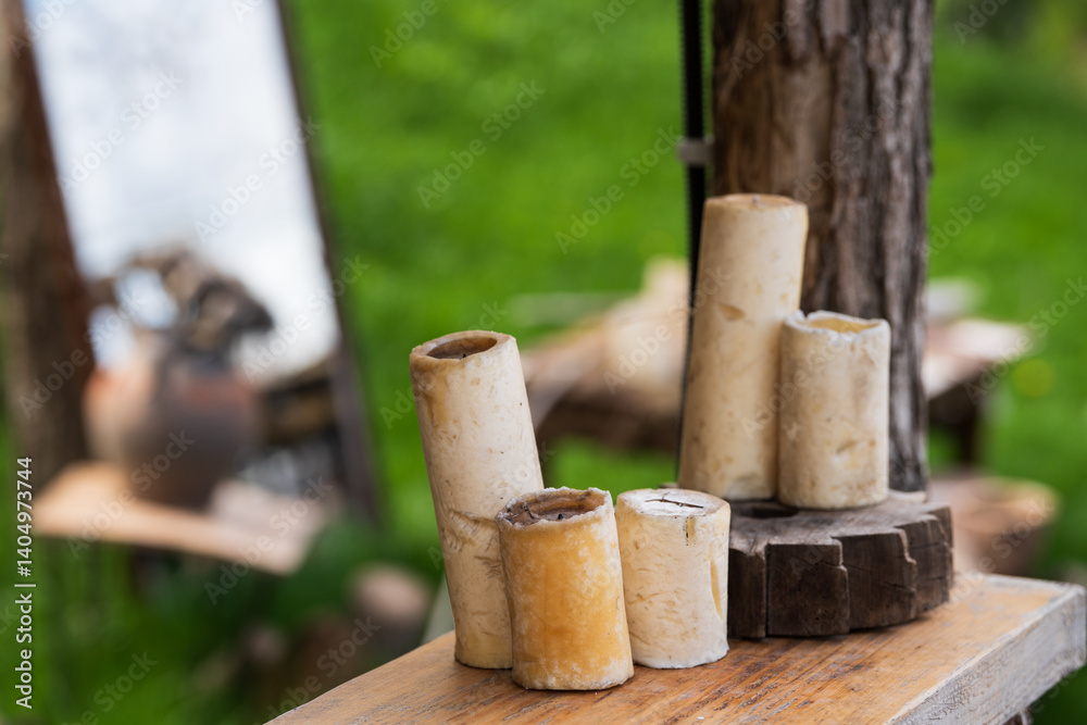 Candles on wooden log, nature background . Candles on wooden log, nature background .