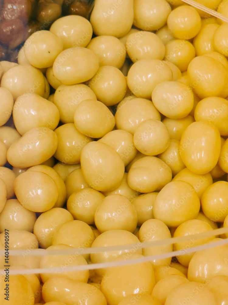 Soft yellow legumes in a container ready for sale at a local market Soft yellow legumes in a container ready for sale at a local market