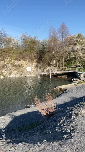 Divers Exploring Underwater Quarry in the Czech Republic