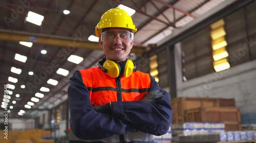 Professional asian man engineer and technician wearing safety helmet analyzing meeting in factory warehouse. Confident factory workers group inspection industry factory. Teamwork concept