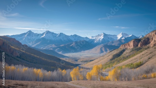Dangerous High Mountain Canyon Surrounded by Colorful Aspen and Green Forest in Fall photo