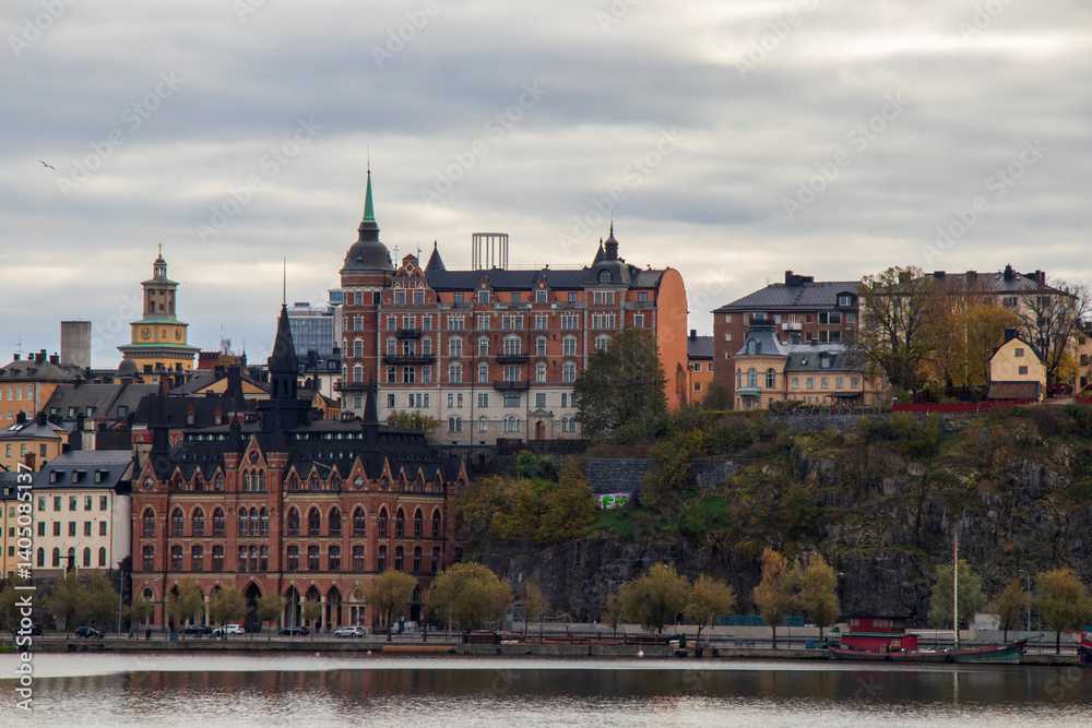 Historic Architecture of Södermalm in Stockholm on Cloudy Autumn Day, Scenic view of Södermalm district with historic buildings by the water in Stockholm, Sweden Historic Architecture of Södermalm in Stockholm on Cloudy Autumn Day, Scenic view of Södermalm district with historic buildings by the water in Stockholm, Sweden
