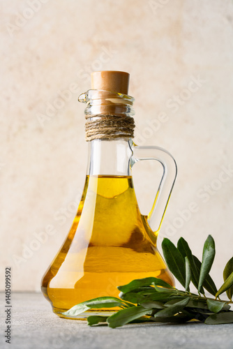 Organic olive oil in a jug on vintage background	
