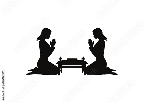 Two People Praying in Spiritual Kneeling Pose