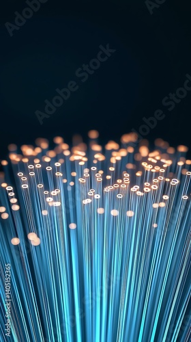 Illuminated fiber optic strands glowing in a dark background. 5G network infrastructure, fiber optics, cloud computing concept.