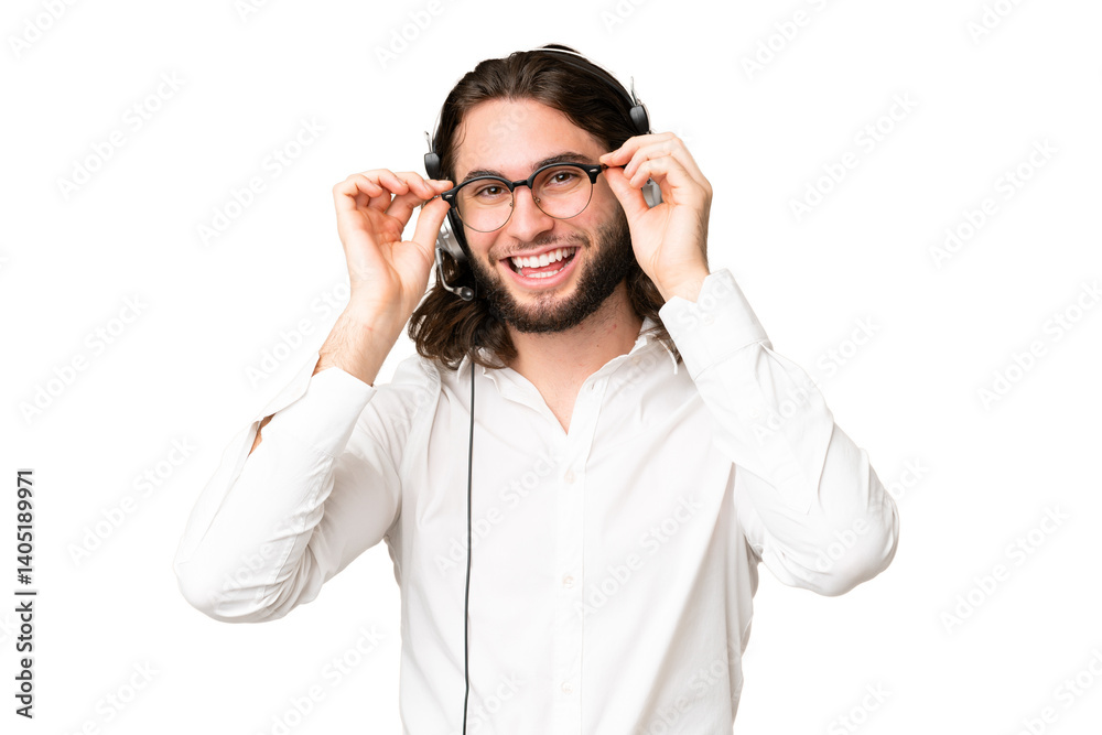 Telemarketer man working with a headset over isolated chroma key background with glasses and surprised Telemarketer man working with a headset over isolated chroma key background with glasses and surprised