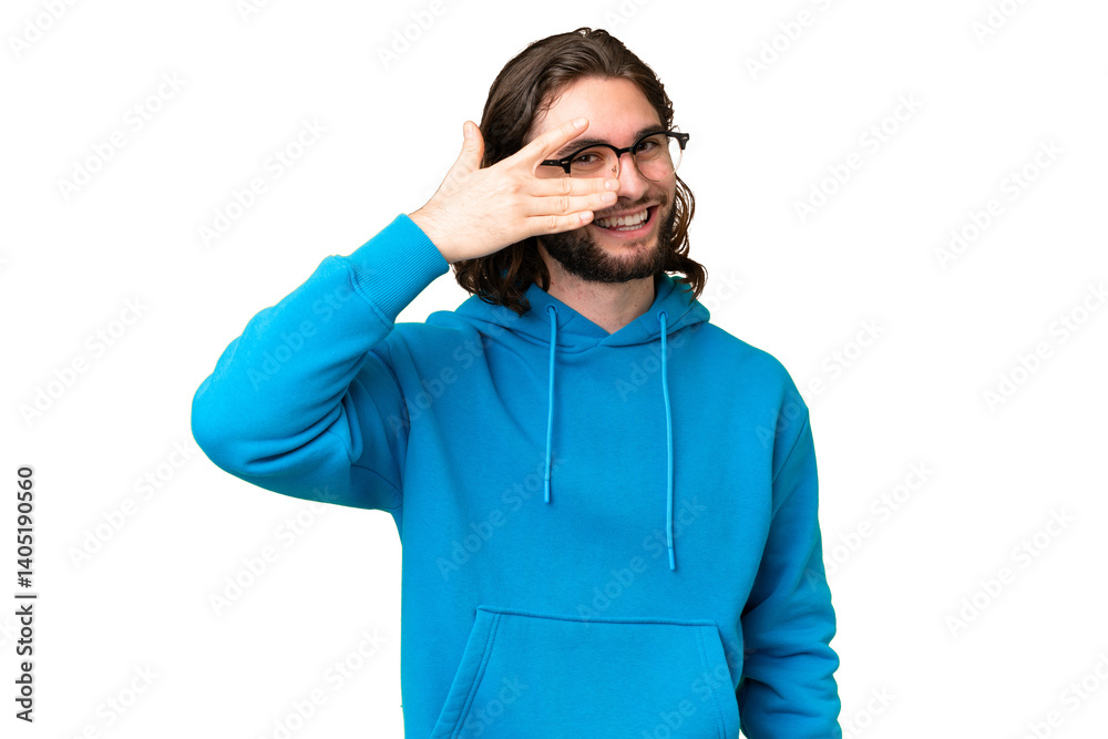 Young handsome man over isolated chroma key background covering eyes by hands and smiling Young handsome man over isolated chroma key background covering eyes by hands and smiling