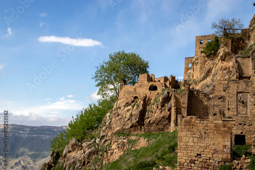  View of the settlement Gamsutl - an ancient village in Dagestan at an altitude of 1500 meters above sea level. At present, the settlement has been abandoned by people. The ghost village is unique  photo