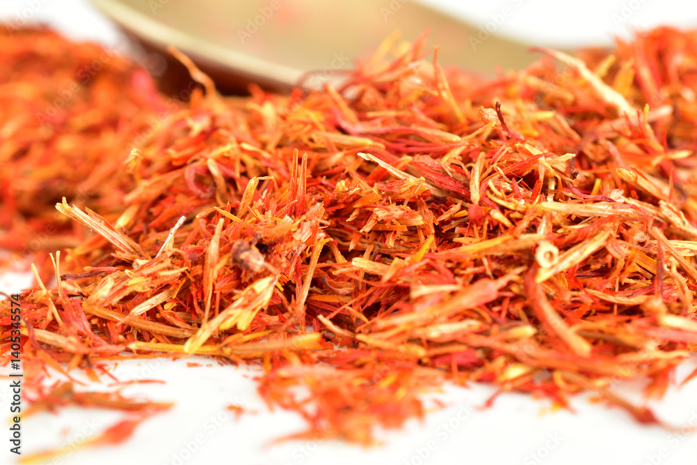 Fototapeta premium Food spice saffron lies on a white background.