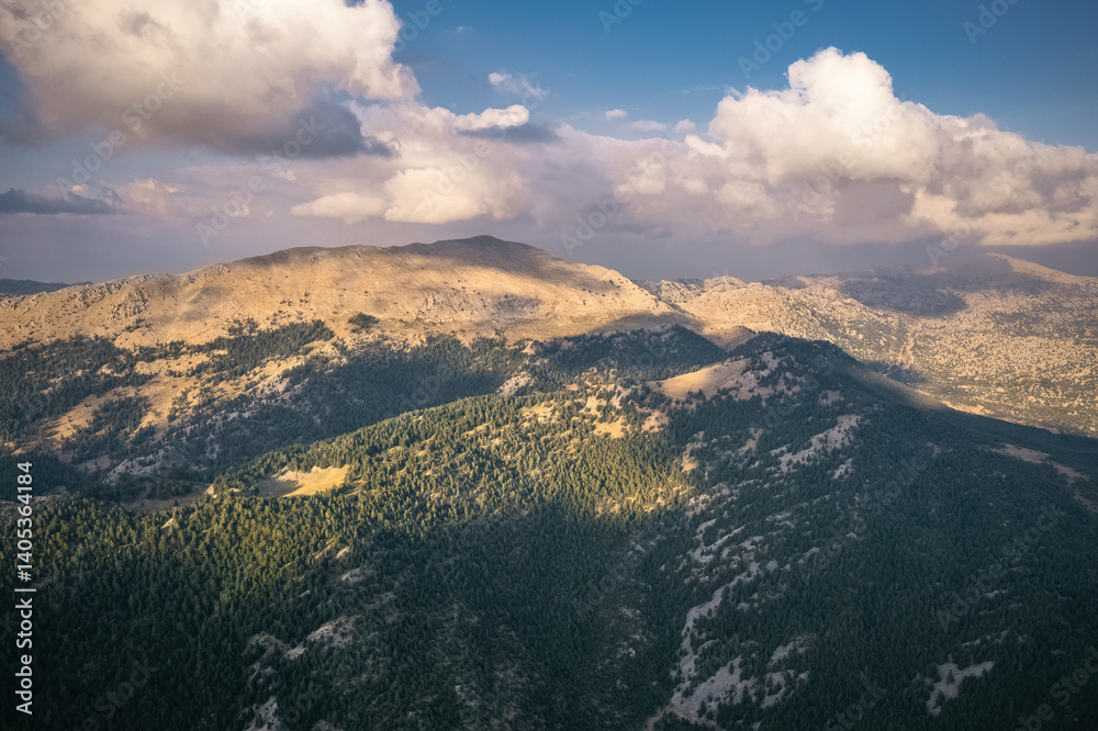 Sunny mountain slopes, sun shadows reflected on distant mountains. Exquisite natural scenery.
