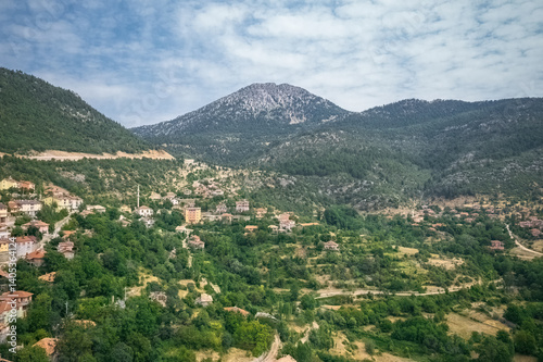 Obraz na płótnie Akseki- Bademli Village.A small mountain village in a green valley among the mountains in Antalya, Turkey. Drone shot. w salonie