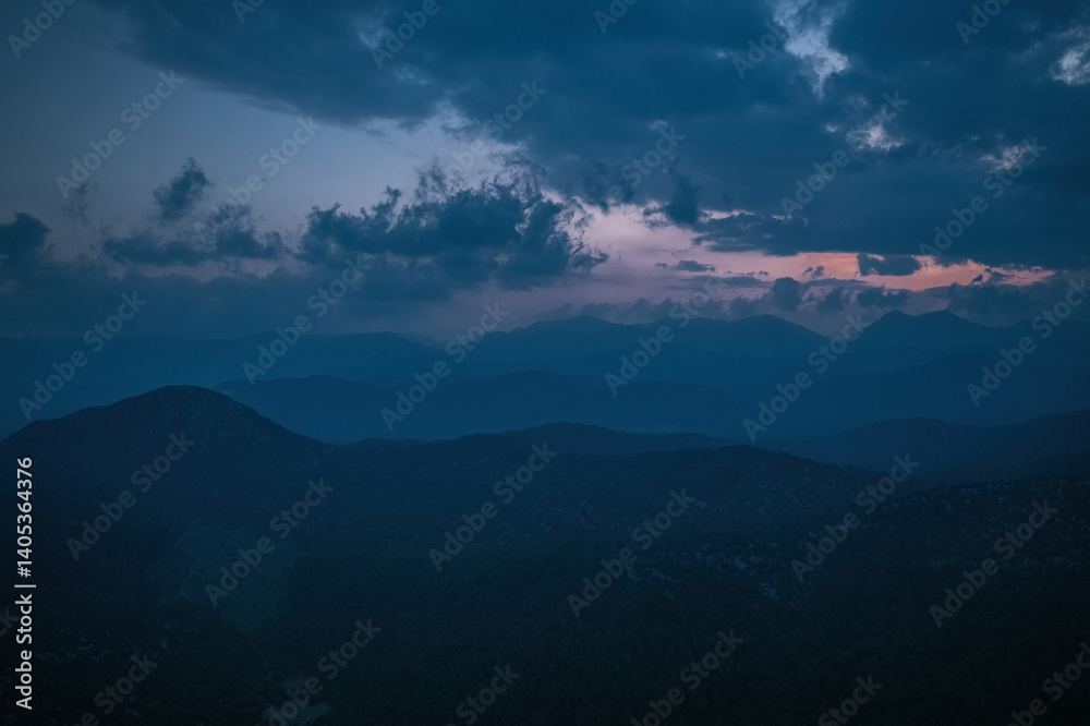 A magnificent combination of cloudy sky and mountain forest scenery. Cloud and mountain slopes.