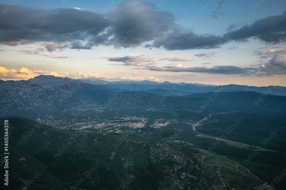 Large, impressive mountains covered with trees in the Akseki district of Antalya. Cloudy skies and unique natural scenery. Antalya, Turkey.
