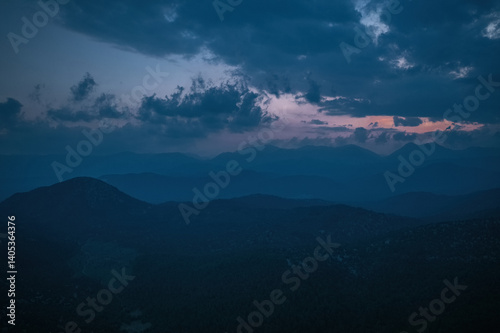 Obraz na płótnie A magnificent combination of cloudy sky and mountain forest scenery. Cloud and mountain slopes. w salonie