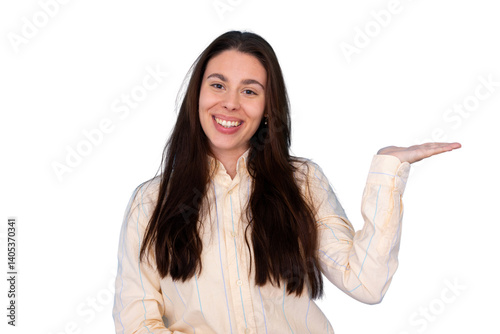 Young businesswoman with long brown hair is smiling and showing something on the palm of her hand