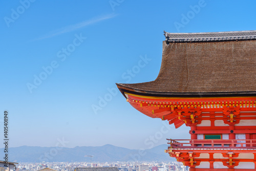 The roof of Kiyomizu-dera Temple with a view of the mountains and sky