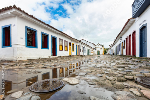 Fototapeta Naklejka Na Ścianę i Meble -  Paraty cobblestone streets and houses with colorful doors of the historic center in Paraty, Rio de Janeiro, Brazil. UNESCO World Heritage Site on the Brazilian Coast
